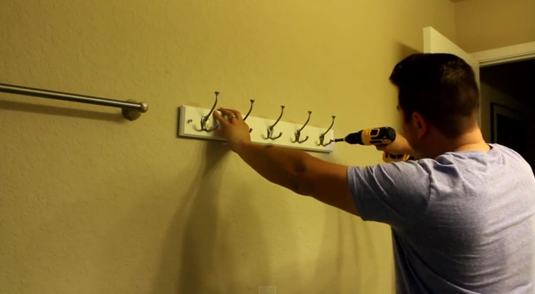 drilling-screws-into-coat-rack